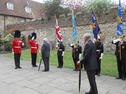 Sir Michael Howard, Guest of honour, inspecting standards and speaking with RSM from the Irish Guards, prior to service at Chichester cathedral