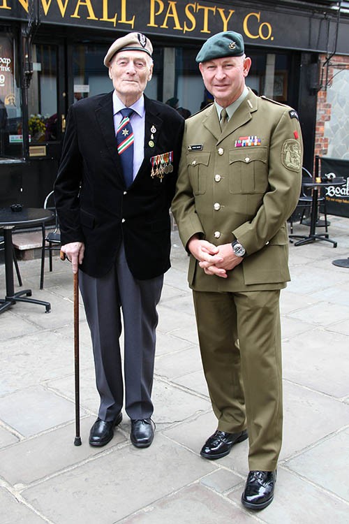 Veteran Bob Tong with Warrant Officer Class One Murray Nelson of New Zealand at the end of the parade